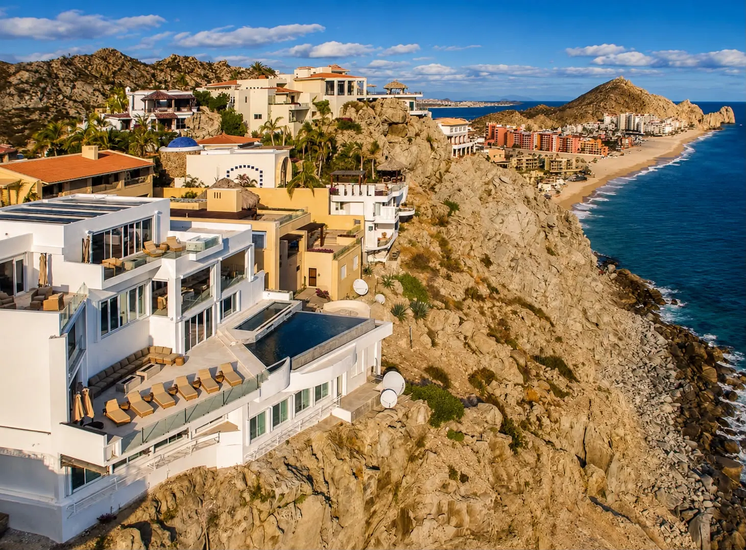 Aerial of Villa Lands End on the Pedregal granite cliffs above the Pacific